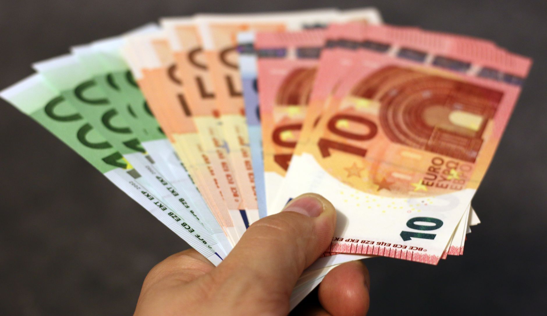 A fan of euro banknotes in different denominations